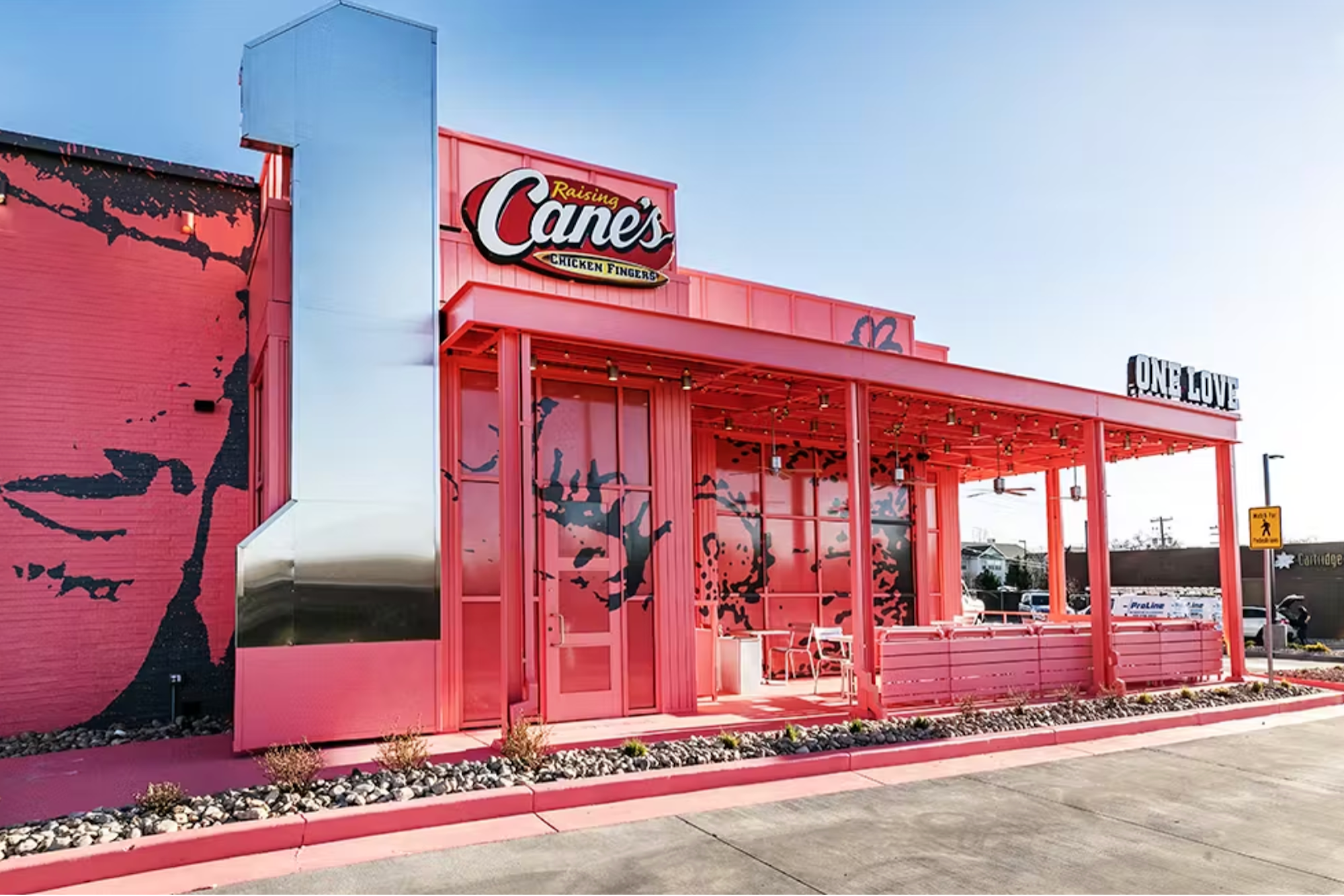 Rapper Post Malone Just Opened a Pink and Tattooed Raising Cane's Location Decorated With 'Old Stinky Outfits'